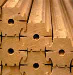 Perfiles macizos de madera para construcción de muros.